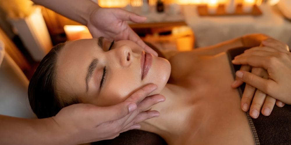 Woman receiving a face massage at a medical spa.