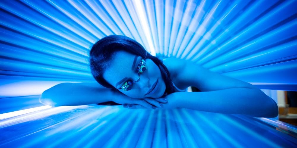 Woman at a tanning salon.